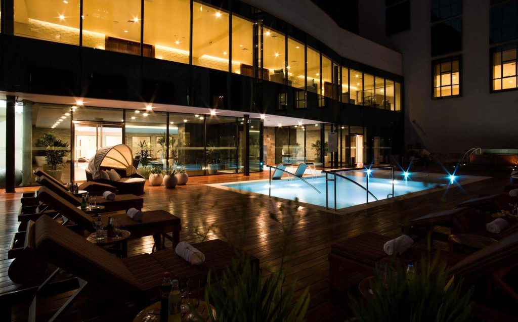 pool and chairs at swissotel hotel in lima peru