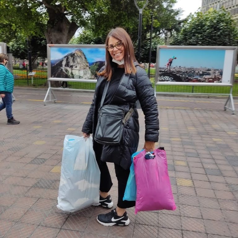 woman wearing crossbody tumi for security, is lima peru safe
carrying shopping bags in plaza