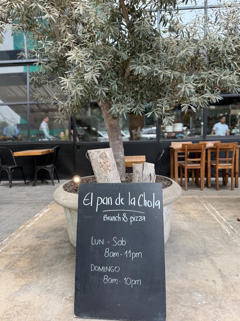 el pan de la chola lunch sign on restaurant patio in lima peru