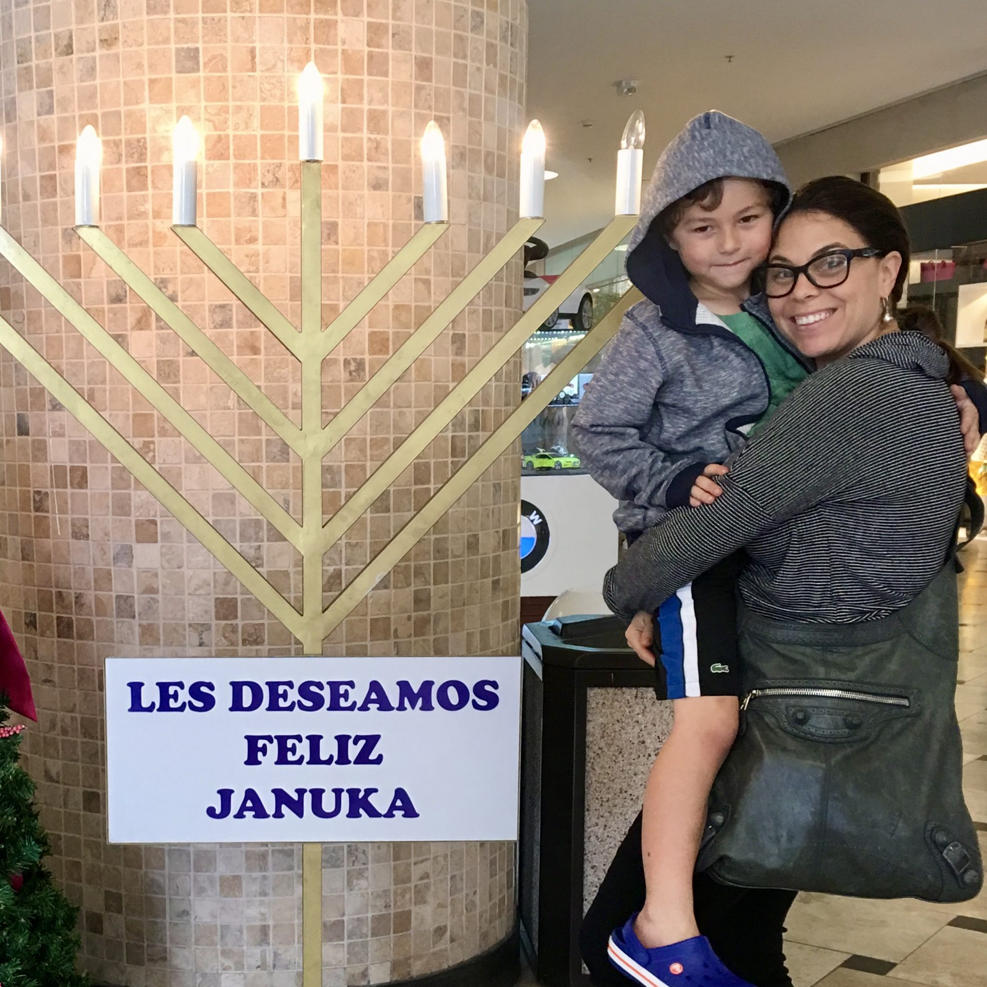 happy woman and her son at jockey plaza, lima peru
