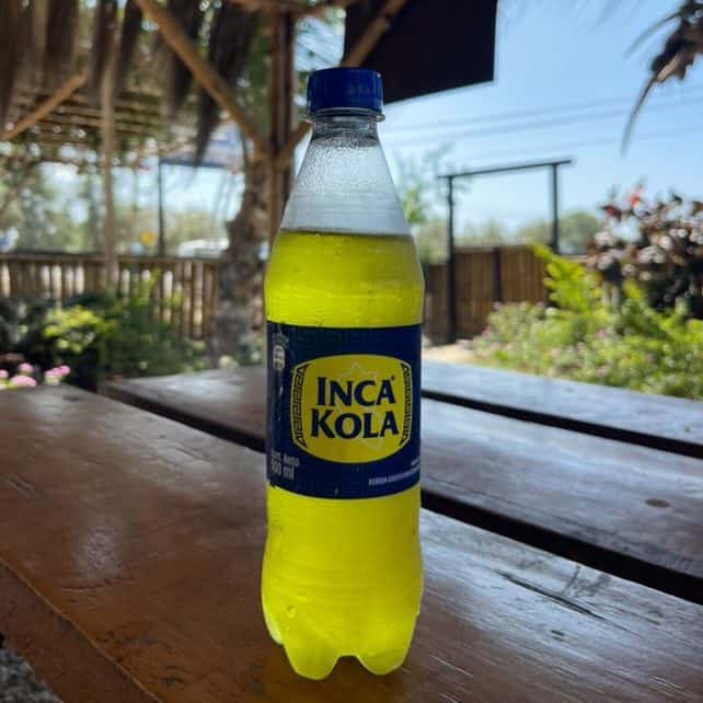 inca kola bottle sitting on outdoor patio table