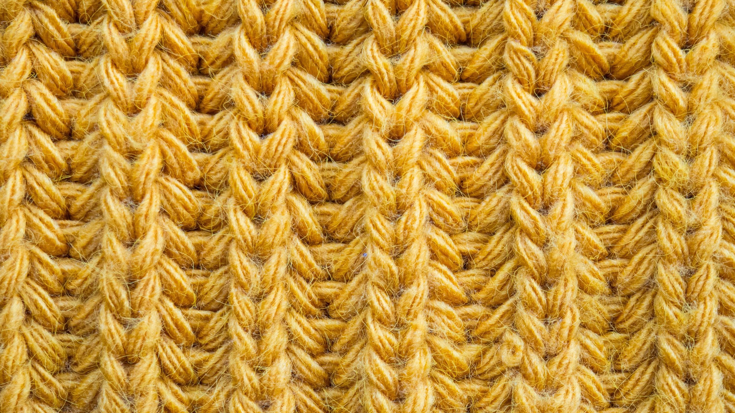 close up of yellow alpaca sweater