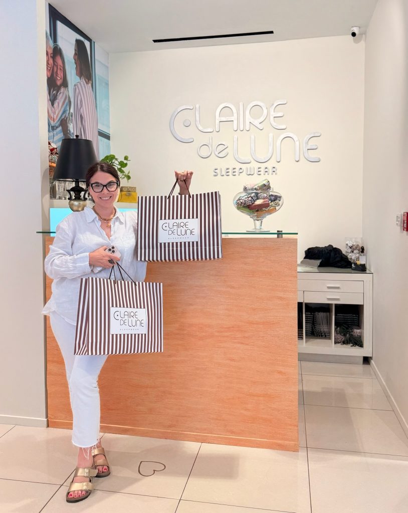 happy woman after shopping at Clare de Lune
