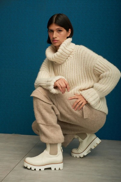 woman posing in white Fringe Mod sweater