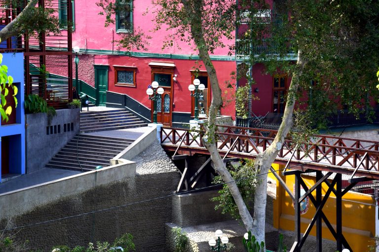 Bridge of Sighs in Barranco, pink building