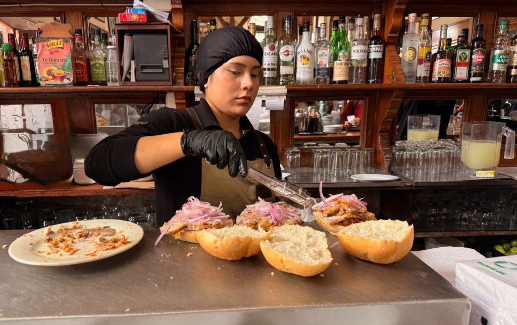 Woman Making Butifaro sandwiches at Bar Cardona in Lima