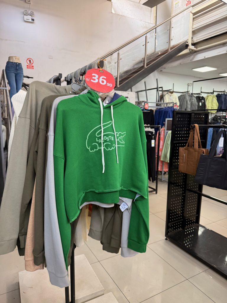 green lacoste sweater in gamarra district shop