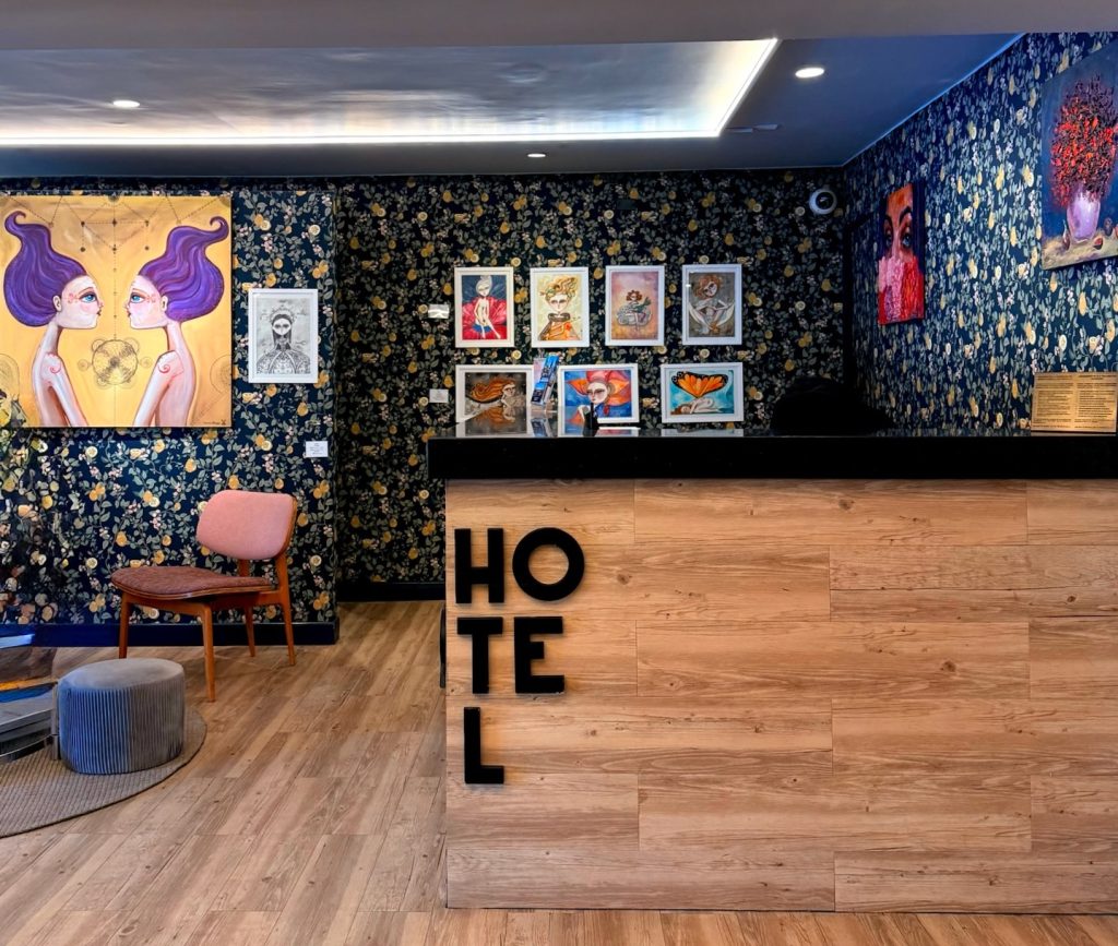 Front desk at the Arte hotel with beautiful wallpaper