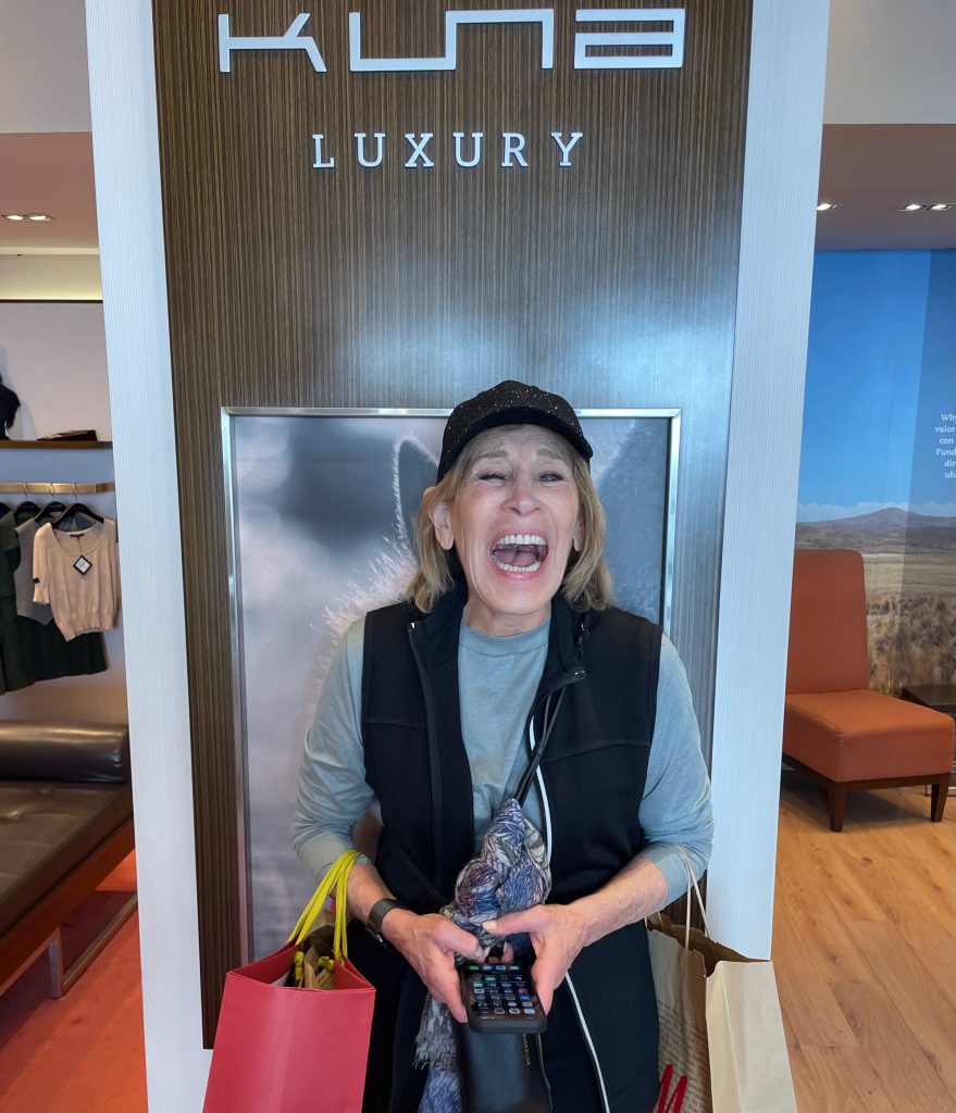 excited woman in kuna luxury brand store lima