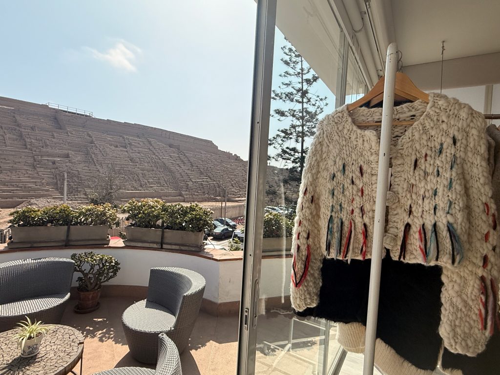 patio view of fringe mod store, rack of sweaters