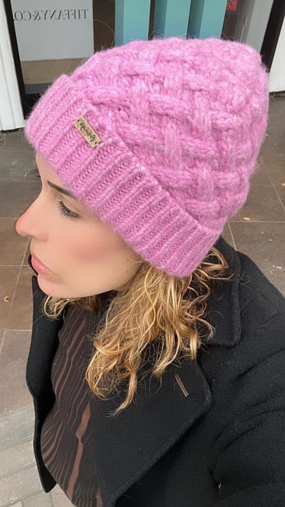 overhead view of woman wearing a pink alpaca wool hat
