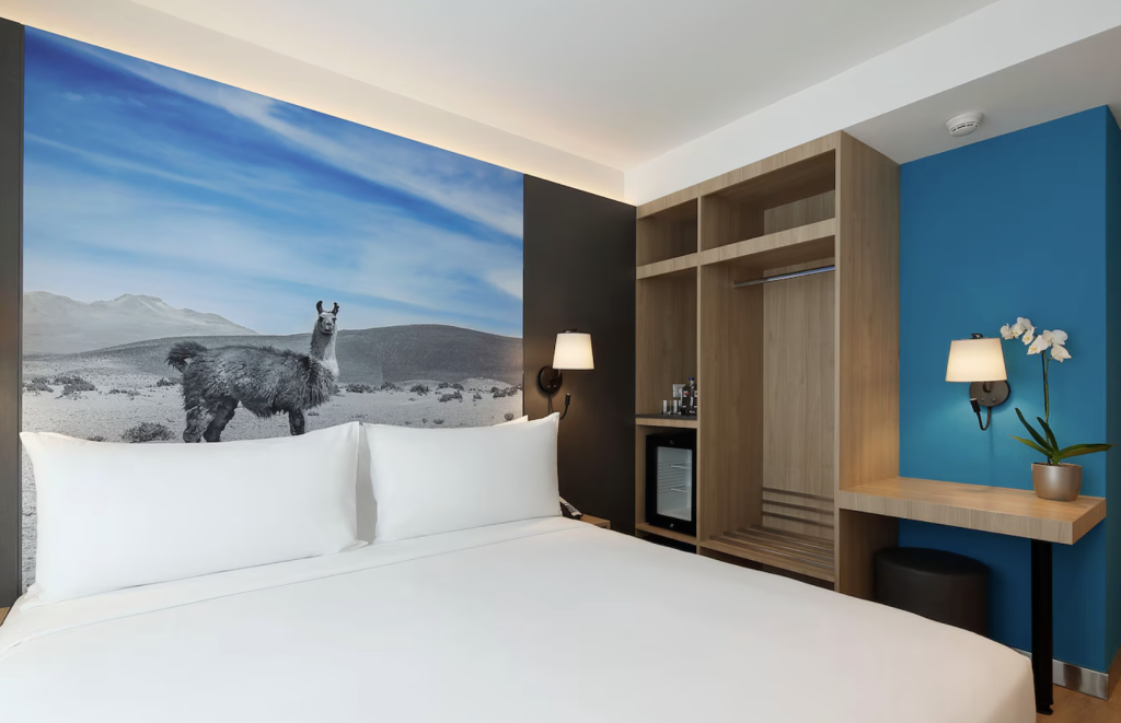 Ikonik Miraflores hotel room with llama backdrop