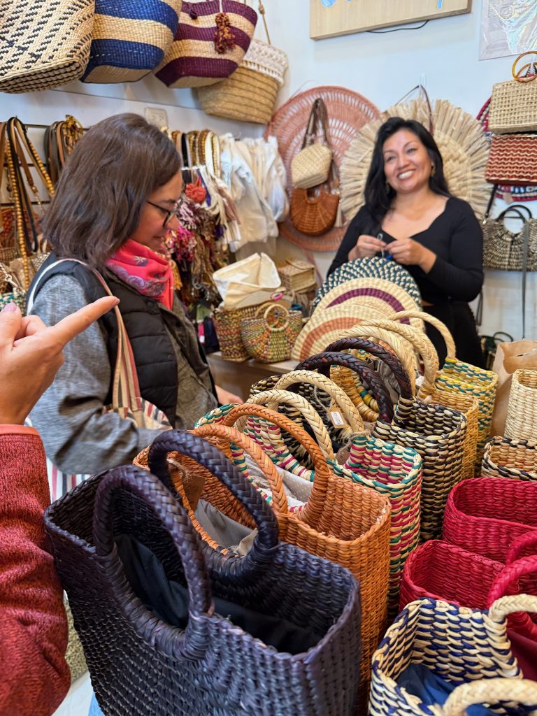 two women exploring small selection of the items at Camaq