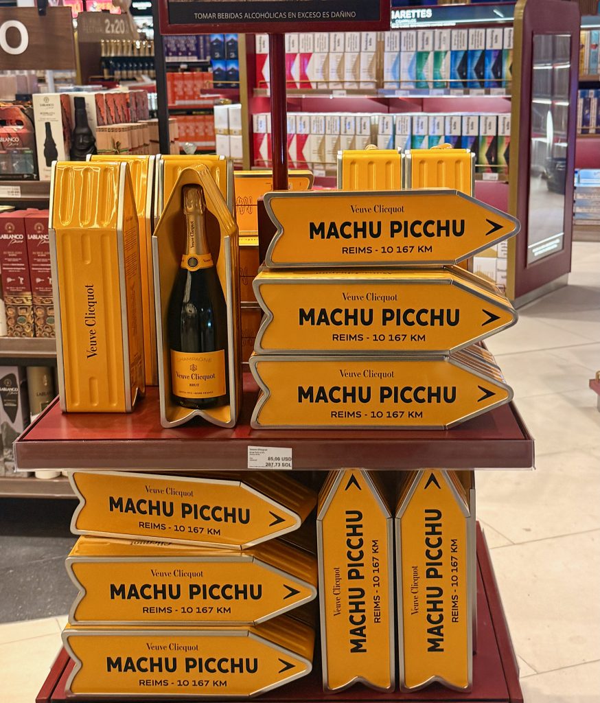 Veuve Clicot meets Machu Picchu signs in airport