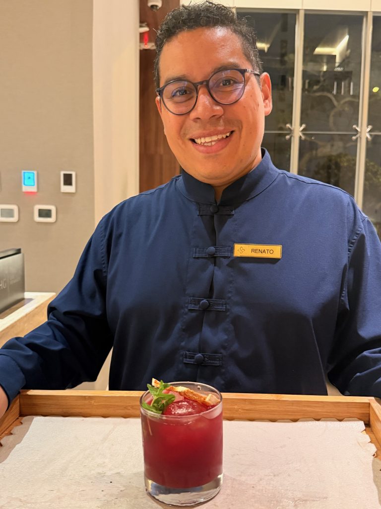 souma hotel staff presenting welcome drink