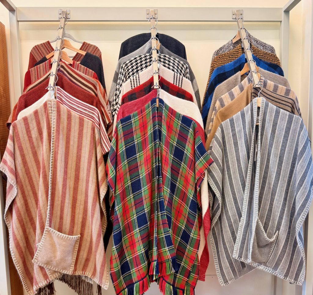 rack of authentic, colorful ponchos at Don Bosco