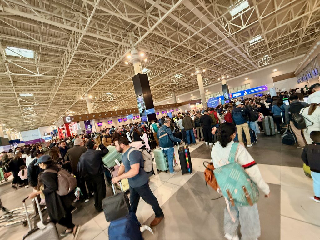 crowded lima airport check in
