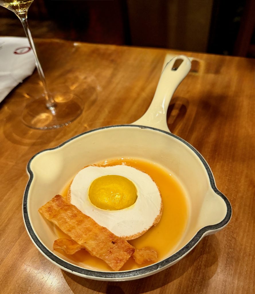 Bacon & Eggs made from Eel and an Amazonian fish, Pistachio cream, bivalves, squid, ají amarillo, leche de tigre, paiche bacon, shoyu