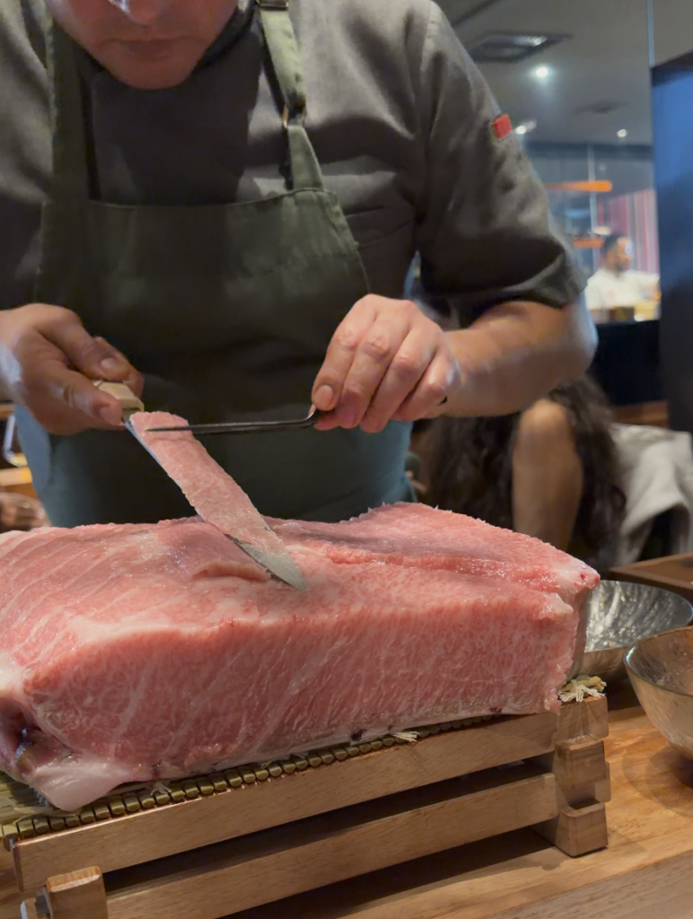 maido chef prepping meat tableside
