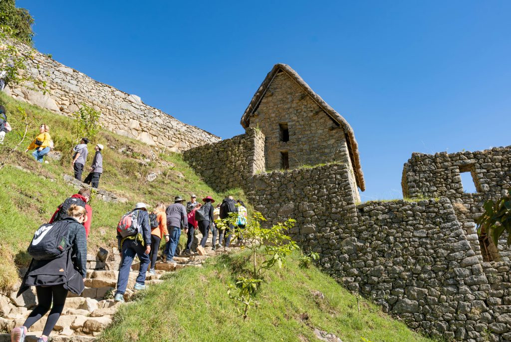 Machu Picchu steps, tourists trekking up