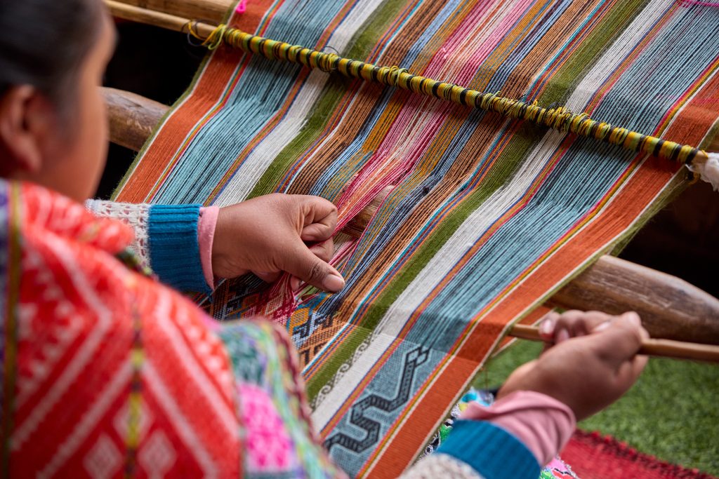 The hands of a weaver hold generations of skill, patience, and creativity, turning simple strands into works of art. Each weave is a journey, each knot a memory.  Chinchero Cusco Peru.