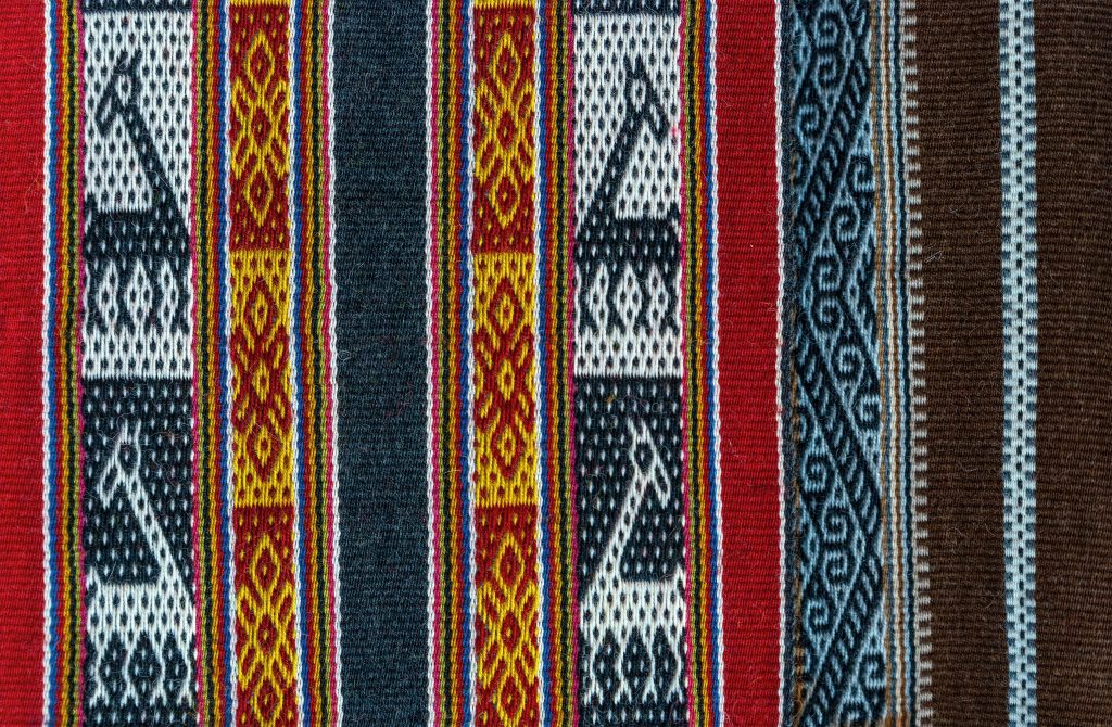 Traditional pallay woven into an Andean textile. These symbolic designs can represent animals, spirituality, community, and everyday life
