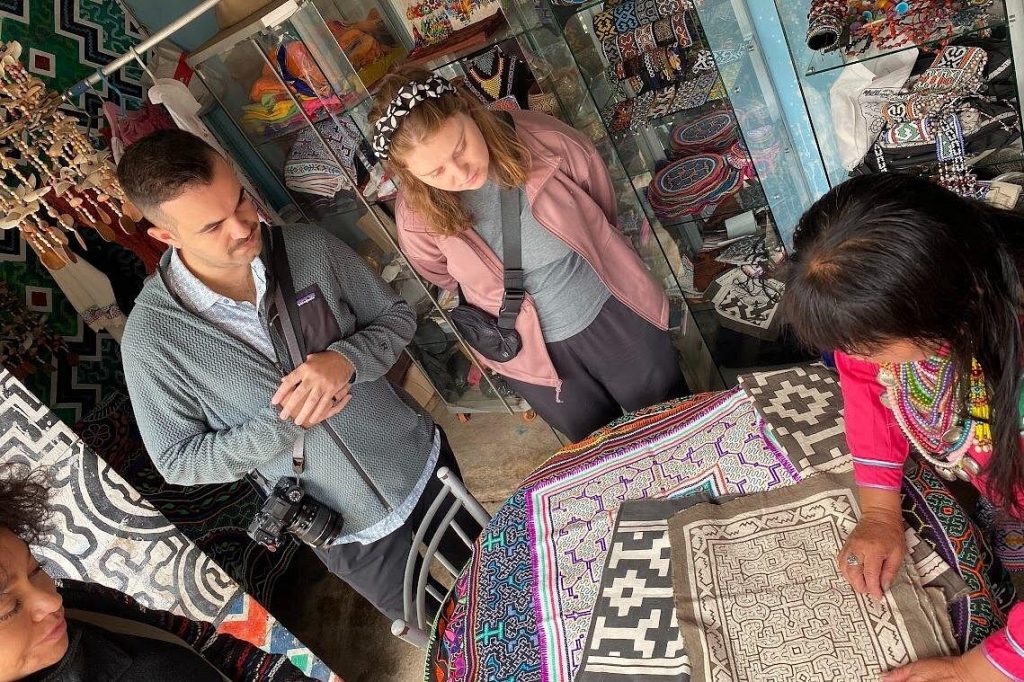 A Shipibo-Konibo artisan explains the meaning behind traditional kené designs, an Indigenous artistic tradition passed down through generations. Photo courtesy of Private Shipibo Craft Village Experience