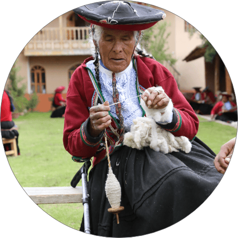 peruvian woman weaving textiles
