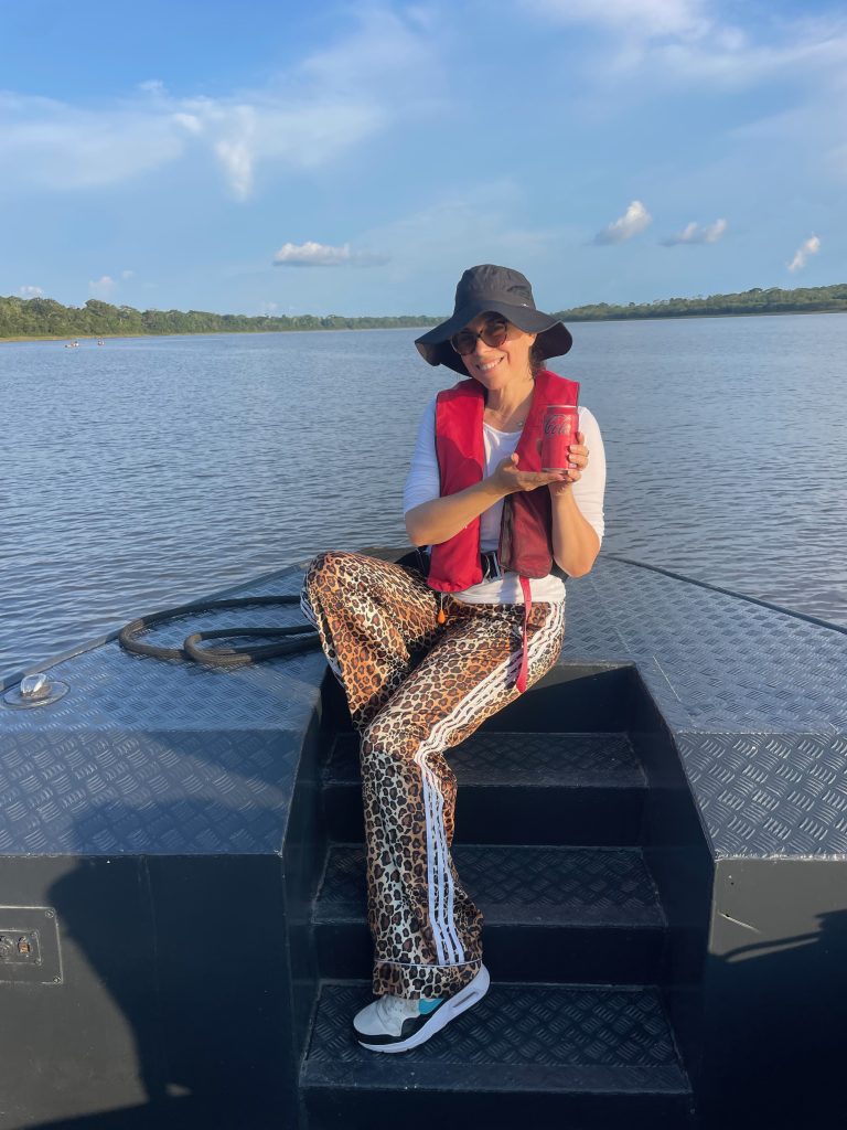 happy woman traveling on the amazon river