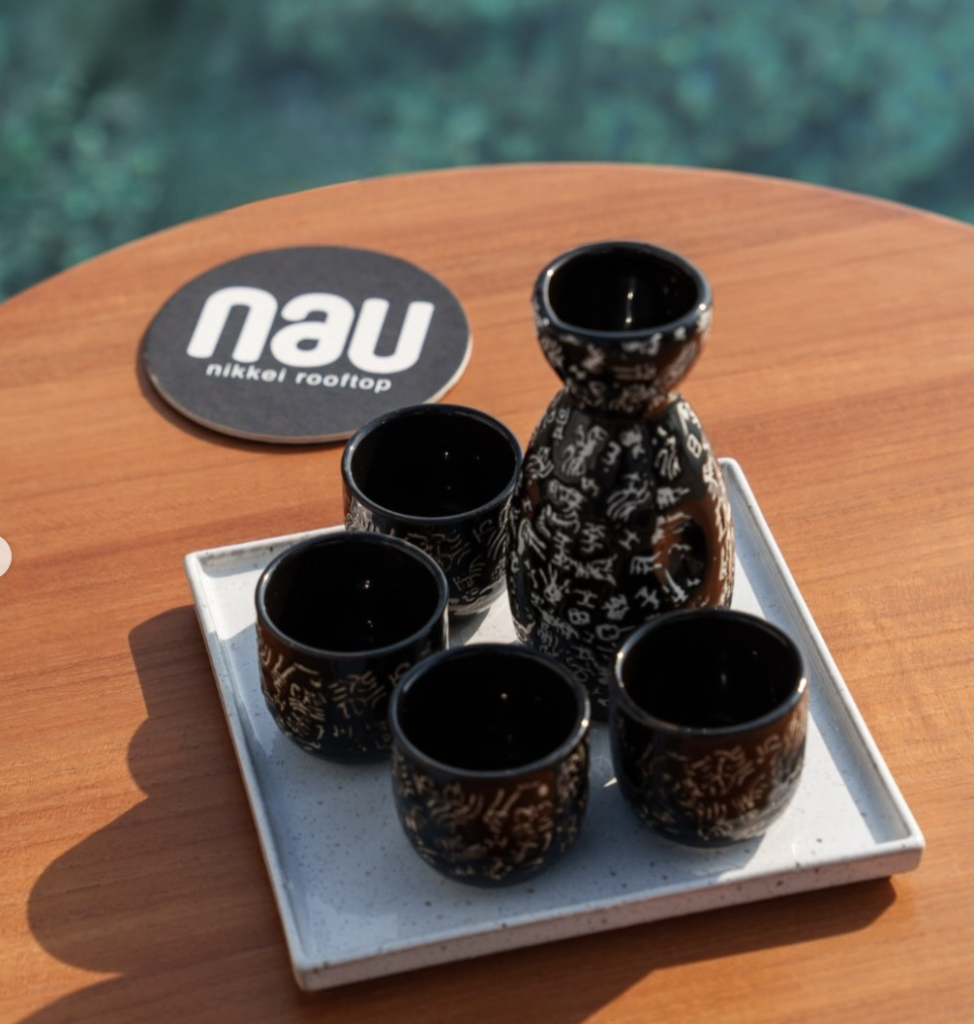 Nau Nikkei Rooftop drink cup display sitting on table